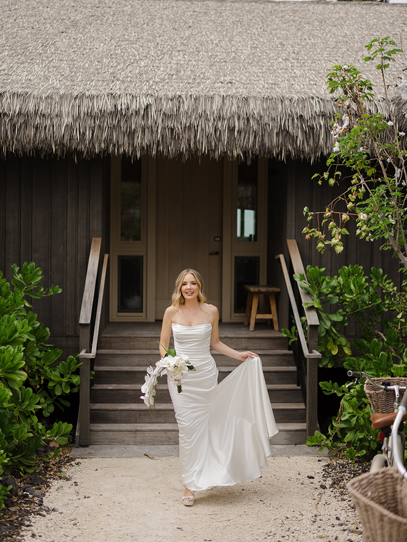 kona-village-rosewood-wedding-bride-exits-bungalow