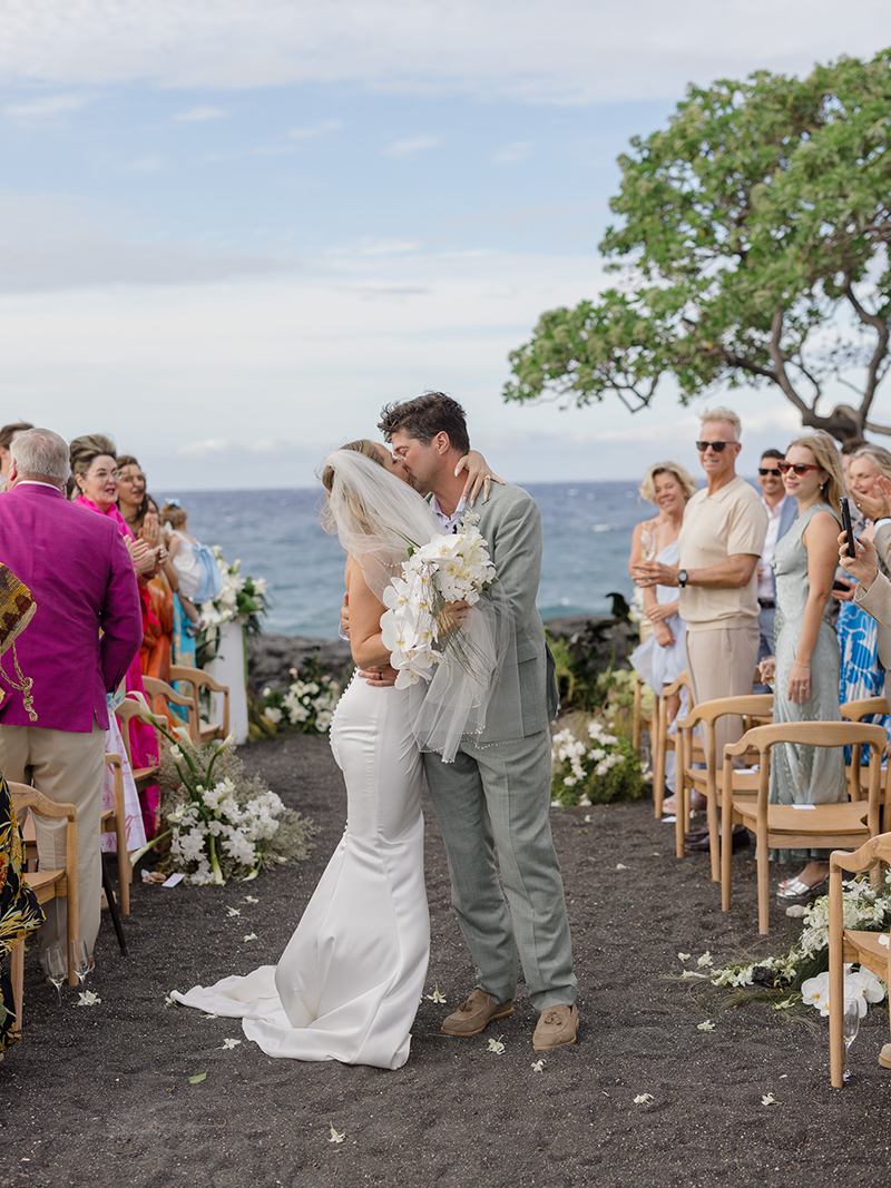 kona-village-rosewood-wedding-newlyweds-ceremony-exit