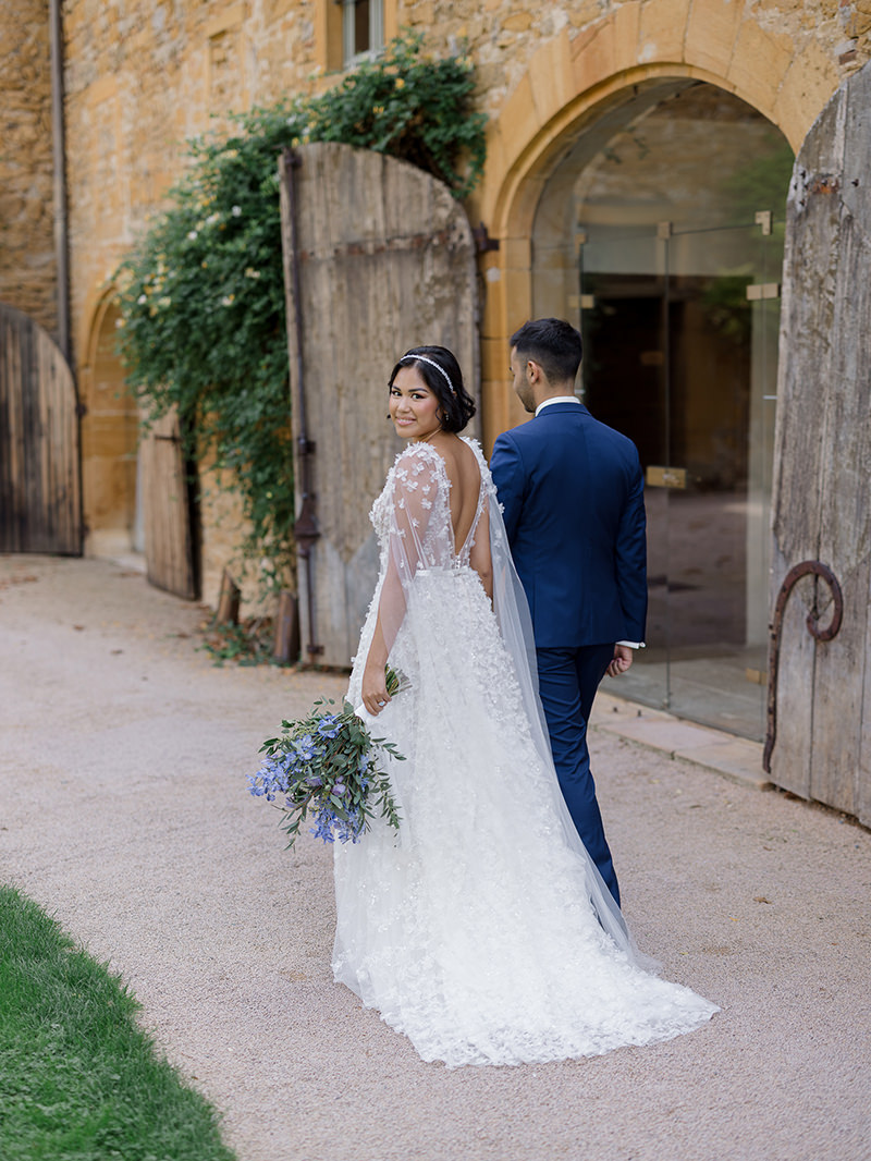 0032-chateau-de-bagnols-wedding-france-bride-groom-historic-chateau-doorway