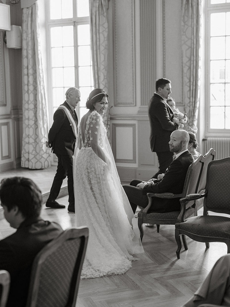0074-chateau-de-bagnols-wedding-france-newlyweds-leaving-civil-ceremony-black-white