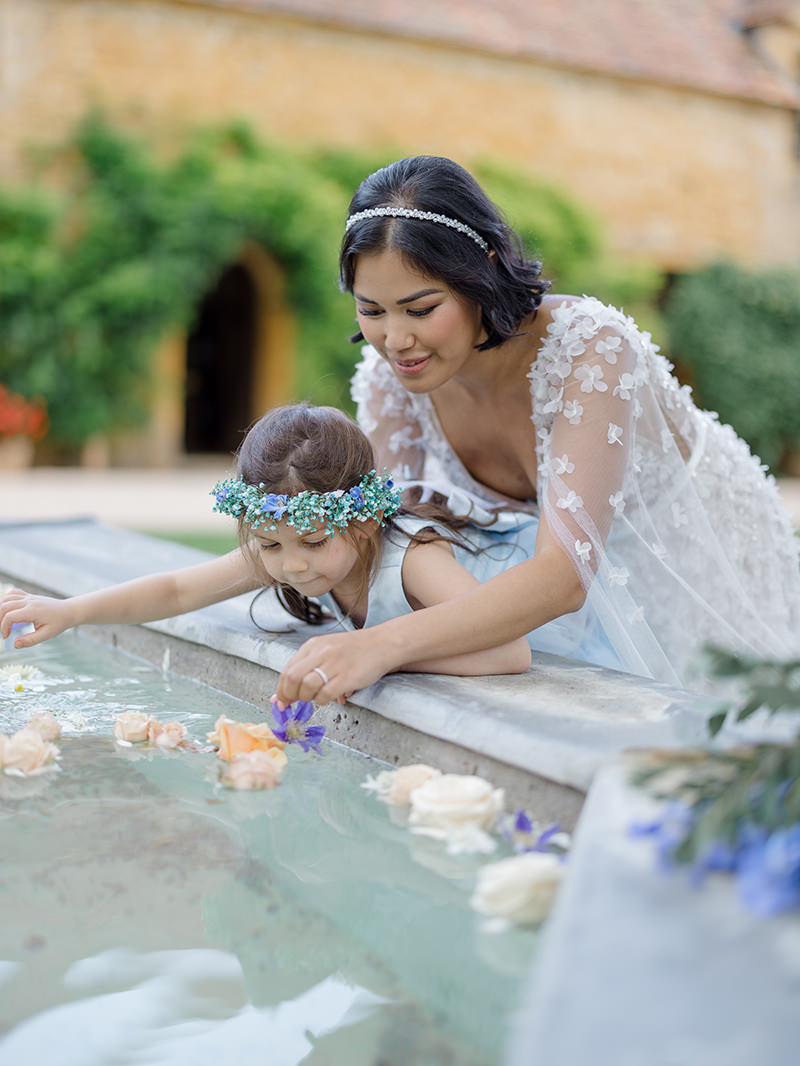 0094-chateau-de-bagnols-wedding-france-bride-flower-girl-fountain
