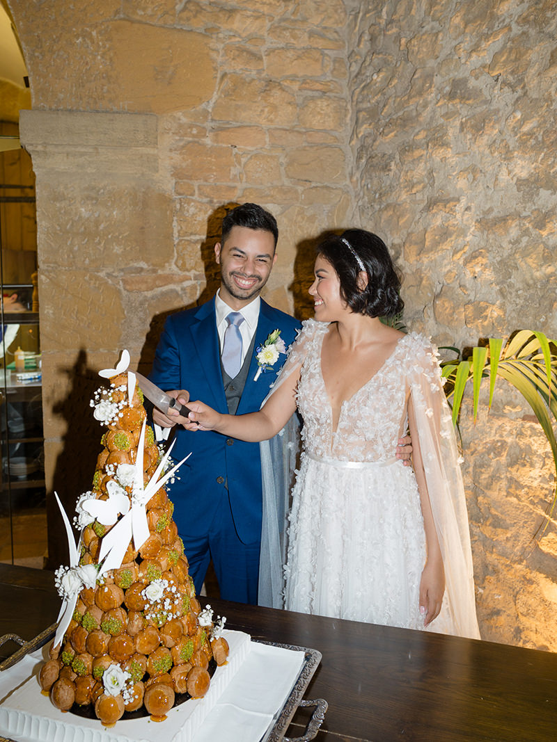 0124-chateau-de-bagnols-wedding-france-bride-groom-croquembouche-cake